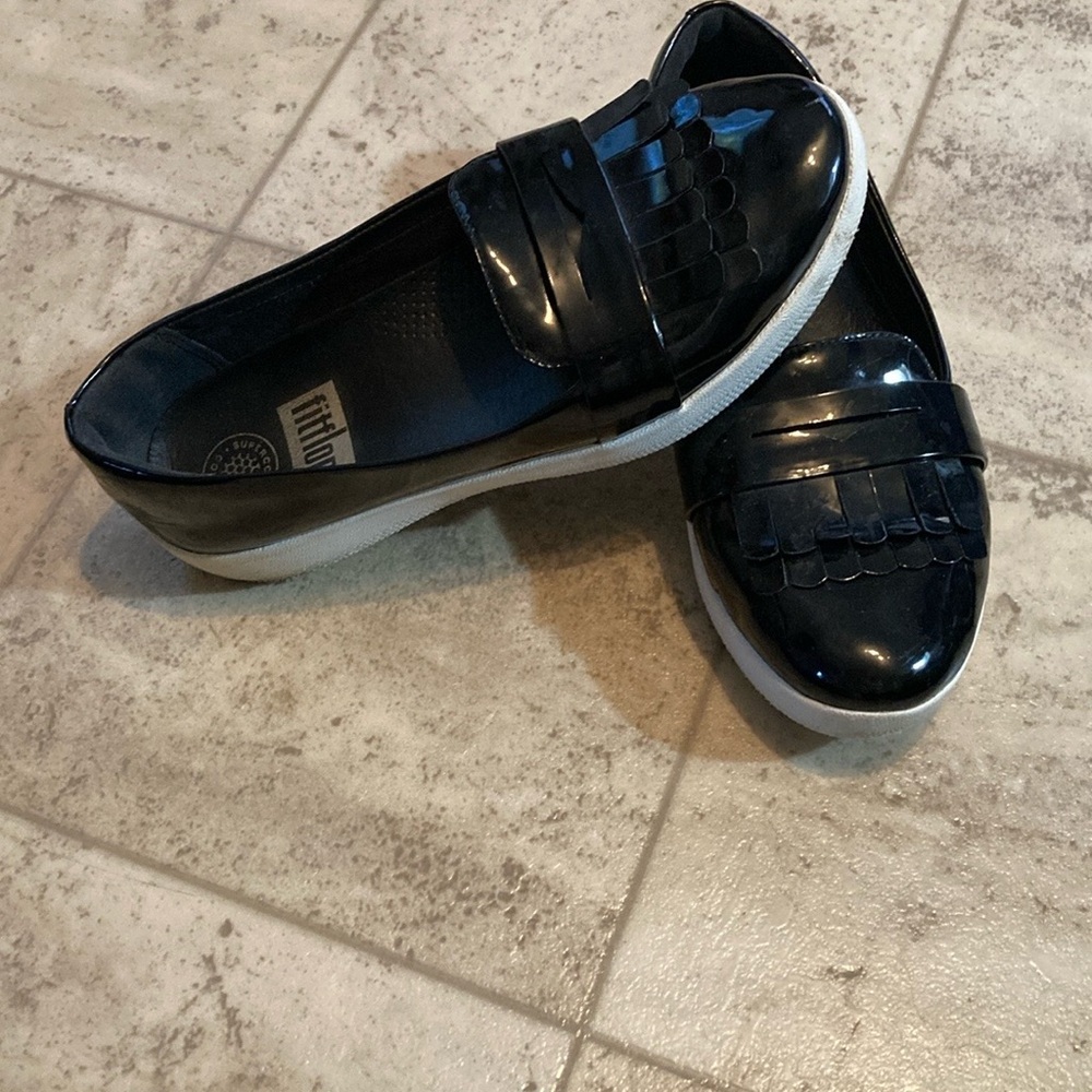 Fit flip black shiny frilly loafers style black shed with small mark on one toe. - Picture 2 of 10